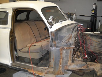 The firewall and front seat during teardown.