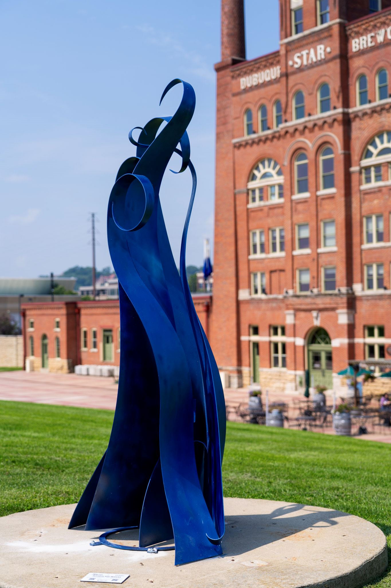 Welded waves of steel painted in reflective bright blue